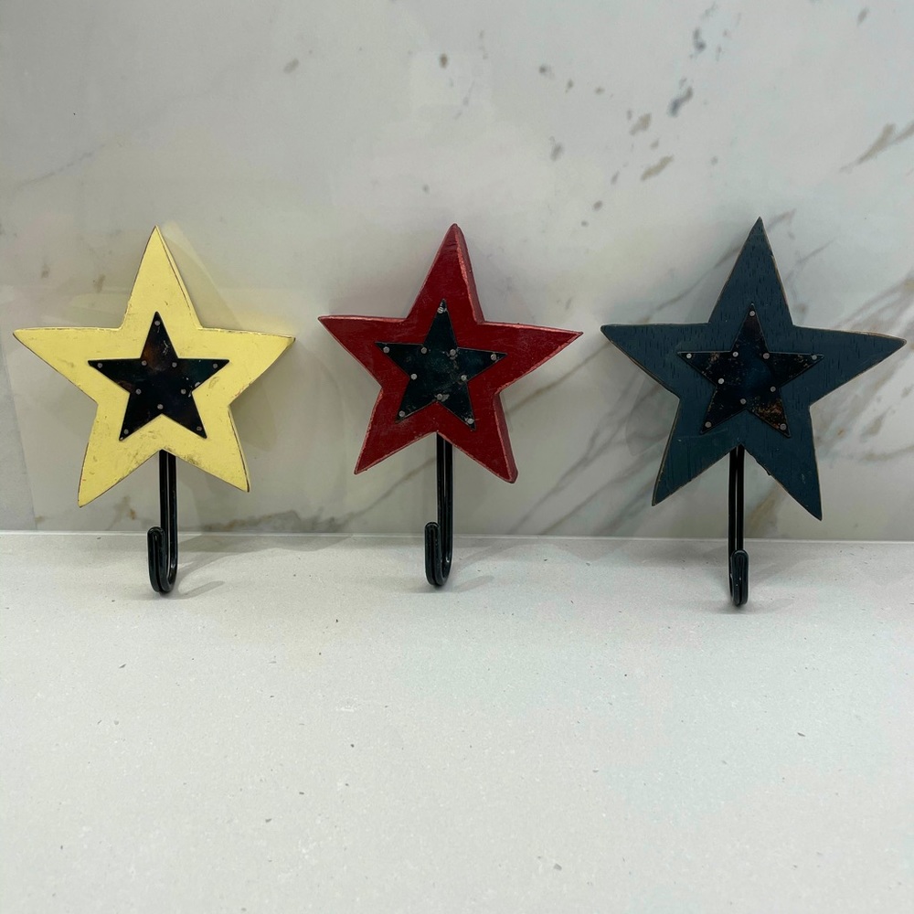 Three, (Red, Yellow and Blue) Star Wall Hooks.
